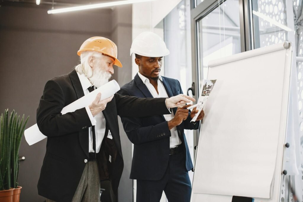 A Two Men Wearing Safety Helmet